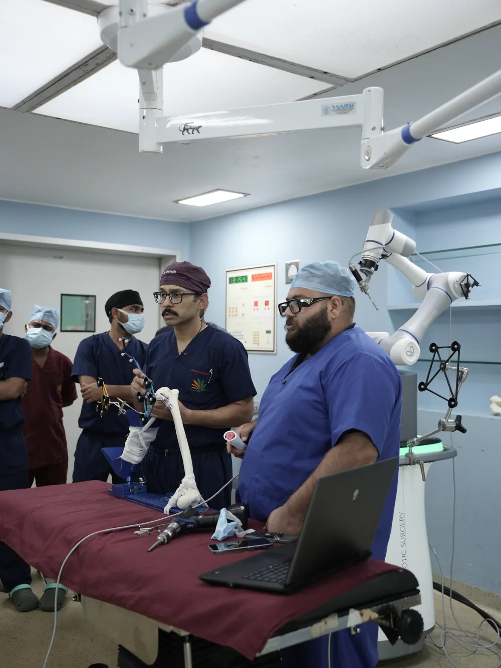 Dr. Unmesh Chakraverty demonstrating surgical technique with the robotic system