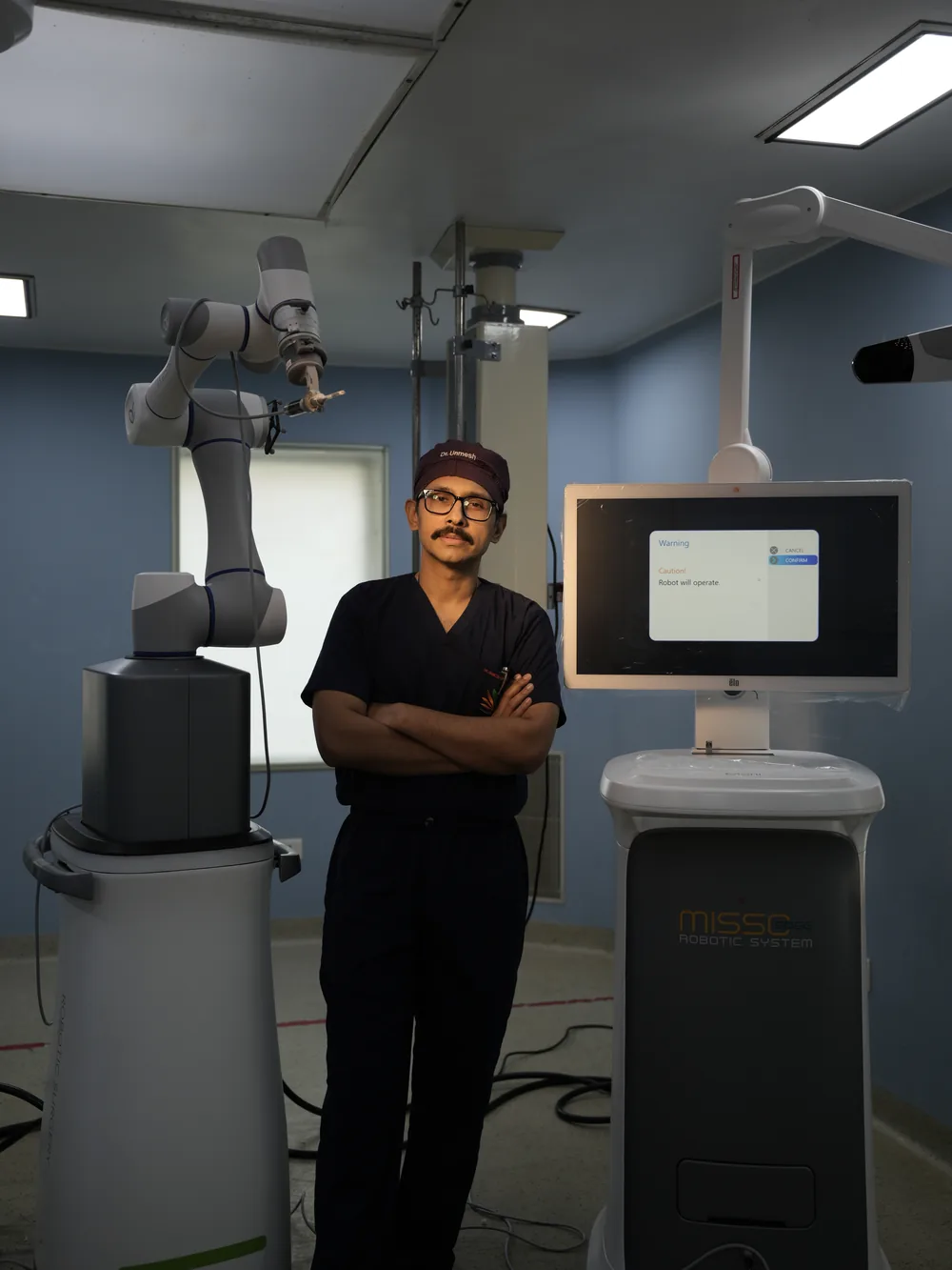 Dr. Unmesh Chakraverty with the MISSO Robotic System in the operating theatre